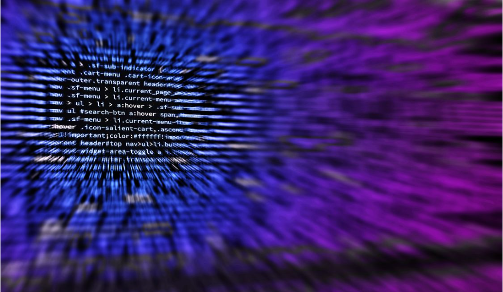 Abstract software HTML and CSS code on a dark background with blue and purple neon glow accents for web development portfolio.
